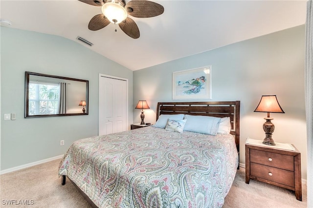 carpeted bedroom featuring a closet, ceiling fan, and lofted ceiling