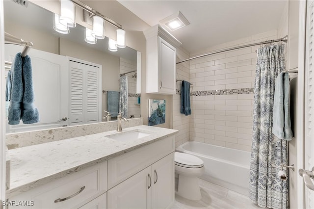 full bathroom featuring vanity, toilet, and shower / bath combo with shower curtain