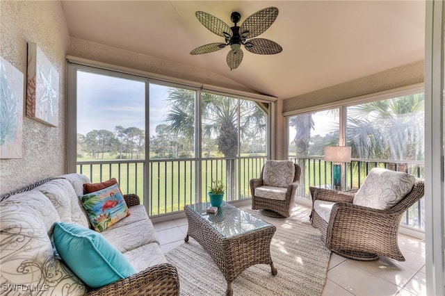 sunroom / solarium with ceiling fan and lofted ceiling