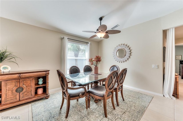 dining area with ceiling fan and light tile patterned flooring