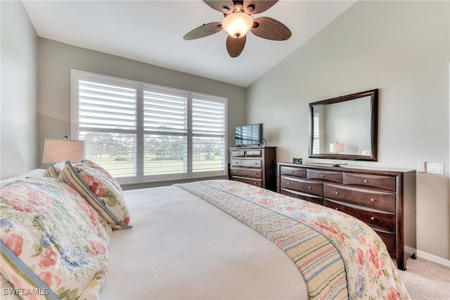 bedroom with ceiling fan, vaulted ceiling, and light carpet