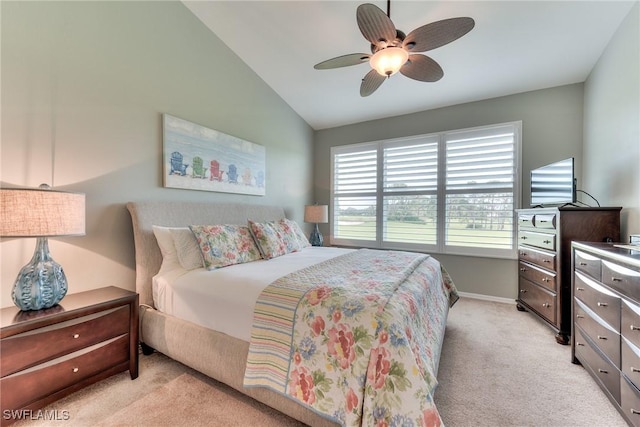 bedroom featuring light carpet, vaulted ceiling, and ceiling fan