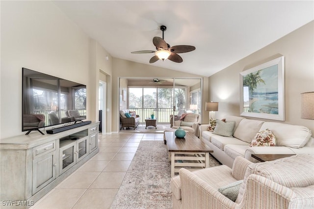 living room featuring light tile patterned floors, vaulted ceiling, and ceiling fan