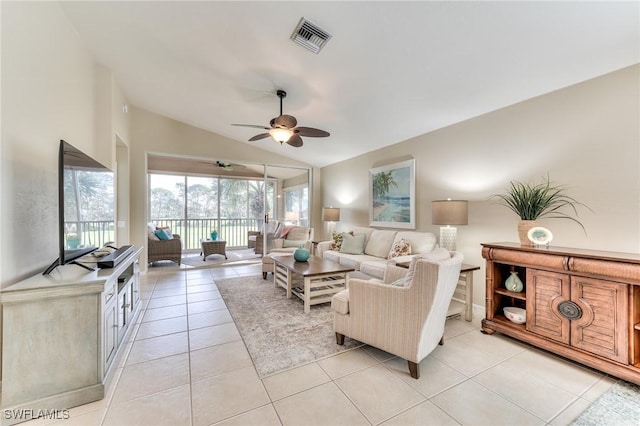 tiled living room featuring vaulted ceiling and ceiling fan