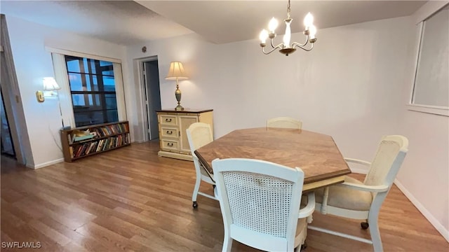 dining room featuring a chandelier and hardwood / wood-style floors