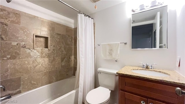 full bathroom with vanity, toilet, and shower / tub combo with curtain