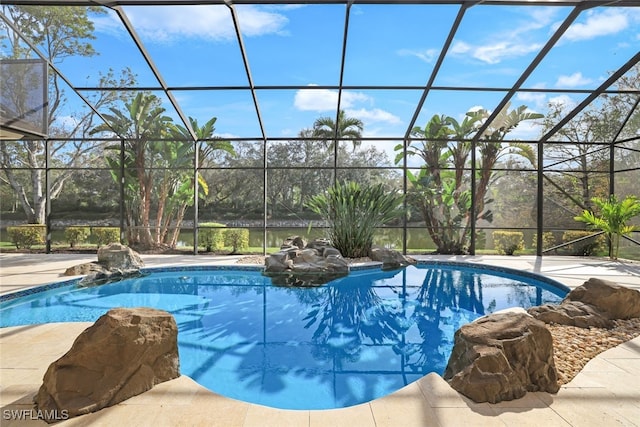 view of pool featuring a lanai