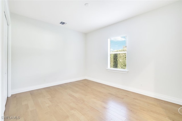 spare room featuring light hardwood / wood-style floors