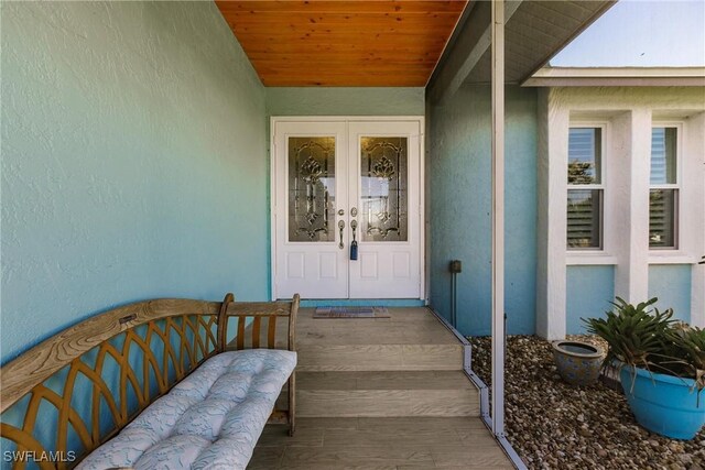 doorway to property featuring french doors