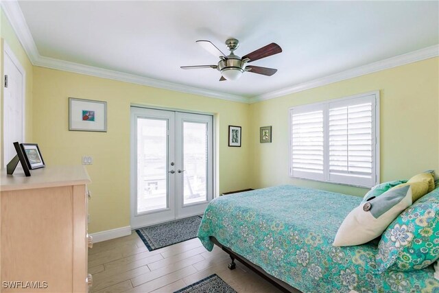 bedroom with ceiling fan, wood finished floors, access to outside, crown molding, and french doors