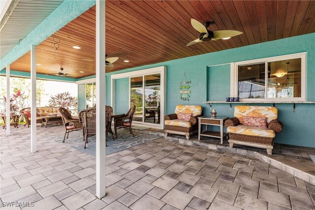 view of patio / terrace with an outdoor living space and ceiling fan