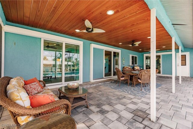 view of patio featuring an outdoor hangout area and ceiling fan