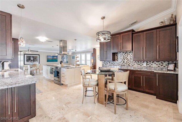 kitchen featuring crown molding, sink, electric range, and decorative light fixtures