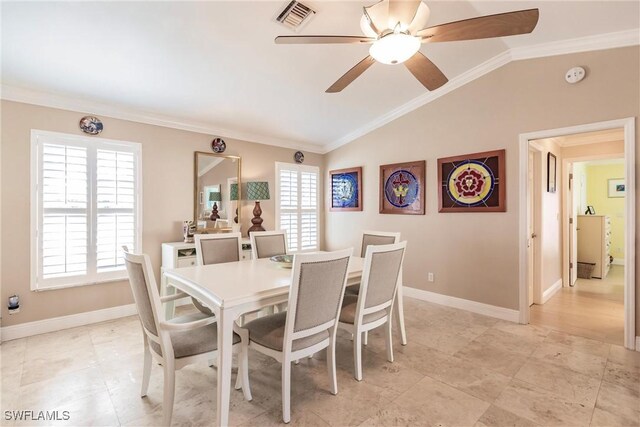 dining room featuring vaulted ceiling, ornamental molding, and ceiling fan