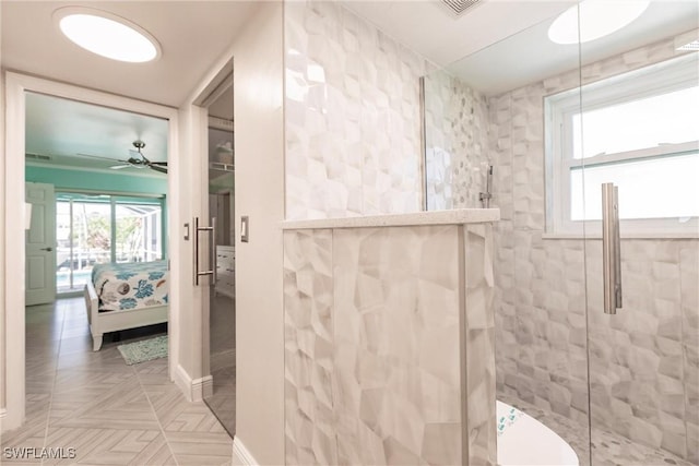 ensuite bathroom with a ceiling fan, baseboards, ensuite bath, and a walk in shower