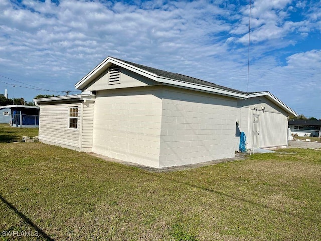 view of property exterior with a yard