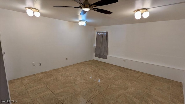 spare room with ceiling fan