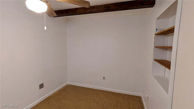 unfurnished room featuring beam ceiling, ceiling fan, and hardwood / wood-style floors