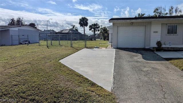 garage featuring a lawn