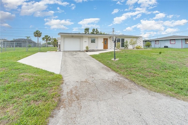 804 Bougainvillea Rd E, Lehigh Acres, FL 33936 - single story home featuring asphalt driveway and an attached garage