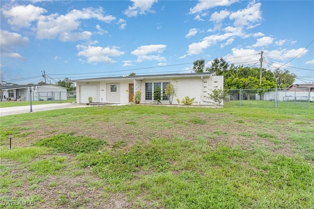804 Bougainvillea Rd E, Lehigh Acres, FL 33936 - view of front of property featuring driveway, a garage, and stucco siding