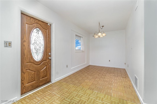 804 Bougainvillea Rd E, Lehigh Acres, FL 33936 - entrance foyer featuring a chandelier and baseboards