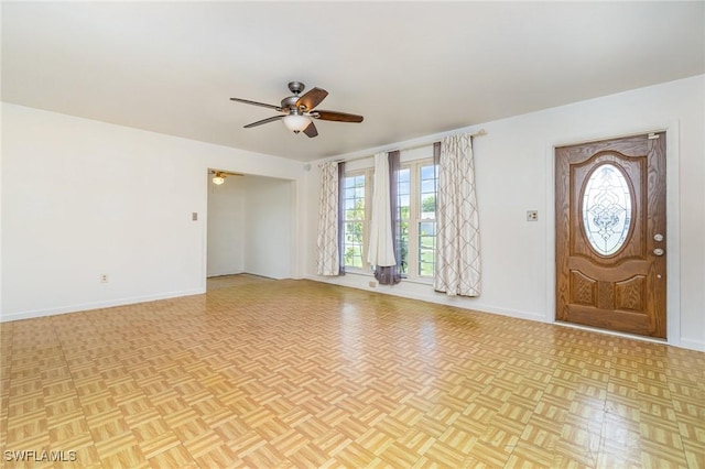 804 Bougainvillea Rd E, Lehigh Acres, FL 33936 - entrance foyer featuring ceiling fan, plenty of natural light, and baseboards