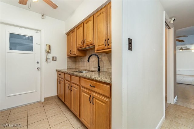 804 Bougainvillea Rd E, Lehigh Acres, FL 33936 - kitchen with ceiling fan, a sink, and light tile patterned floors