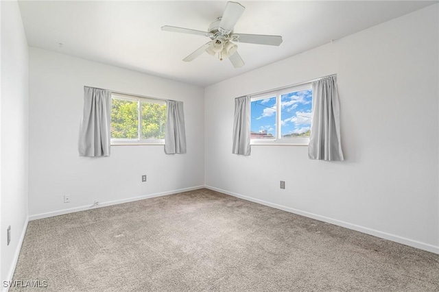 804 Bougainvillea Rd E, Lehigh Acres, FL 33936 - carpeted spare room with baseboards and ceiling fan