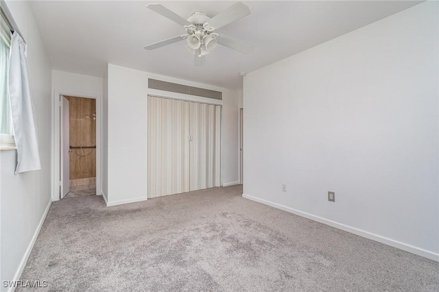 804 Bougainvillea Rd E, Lehigh Acres, FL 33936 - unfurnished bedroom featuring carpet flooring, baseboards, a ceiling fan, and a closet