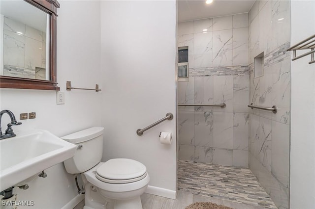 804 Bougainvillea Rd E, Lehigh Acres, FL 33936 - bathroom with toilet, a marble finish shower, baseboards, and a sink