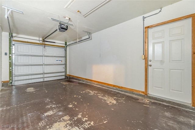 804 Bougainvillea Rd E, Lehigh Acres, FL 33936 - garage featuring baseboards and a garage door opener