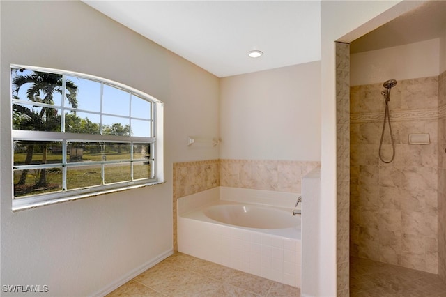 bathroom featuring separate shower and tub and tile patterned flooring