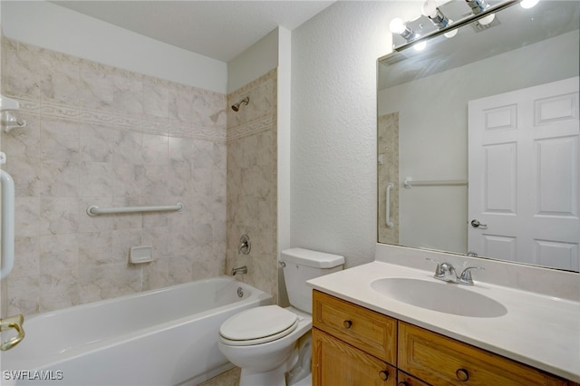 full bathroom with toilet, vanity, and tiled shower / bath