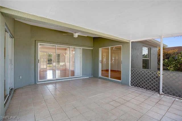 view of patio featuring ceiling fan