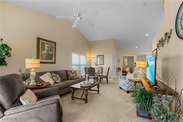 carpeted living room featuring ceiling fan and high vaulted ceiling