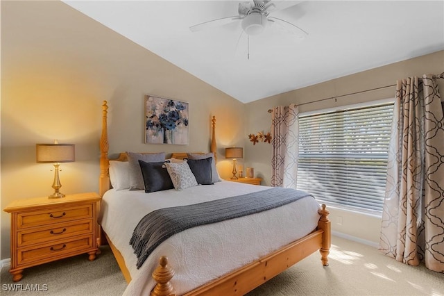 carpeted bedroom with ceiling fan and lofted ceiling