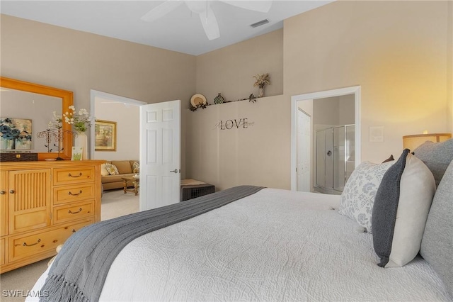 carpeted bedroom featuring ensuite bathroom and ceiling fan