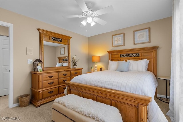 bedroom with light carpet and ceiling fan