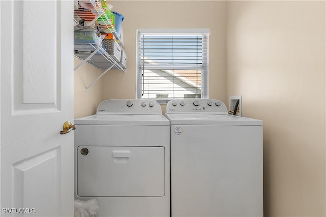 clothes washing area featuring washing machine and dryer