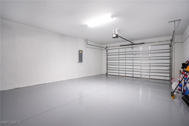 garage featuring a garage door opener and electric panel