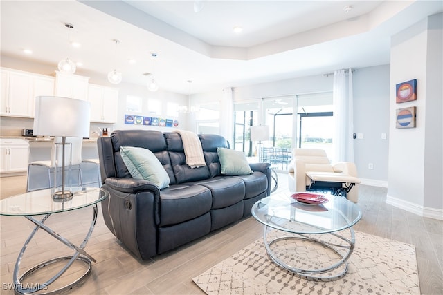 living room with a raised ceiling