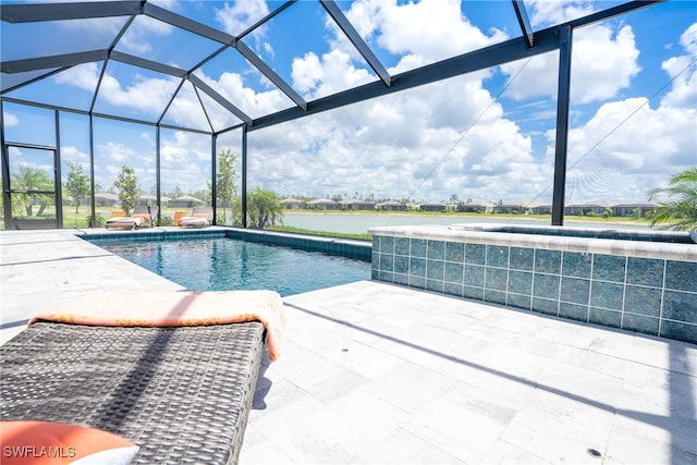 view of pool featuring a water view, a lanai, and a patio area