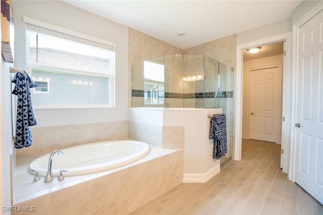 bathroom featuring plus walk in shower