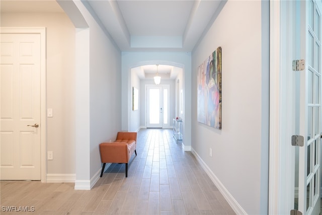 corridor with a tray ceiling