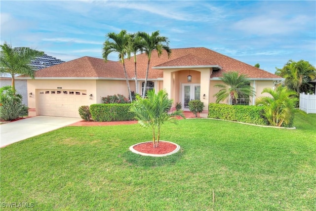 view of front of home with a garage and a front yard