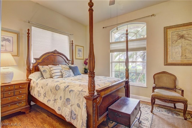 bedroom featuring hardwood / wood-style flooring and ceiling fan