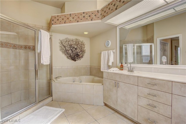 bathroom featuring tile patterned floors, separate shower and tub, and vanity