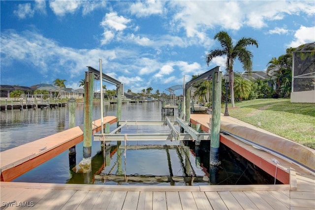 view of dock featuring a yard and a water view