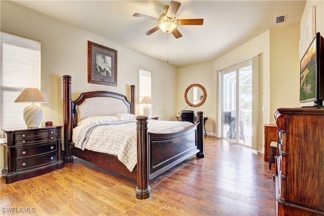 bedroom with access to exterior, ceiling fan, and light hardwood / wood-style floors